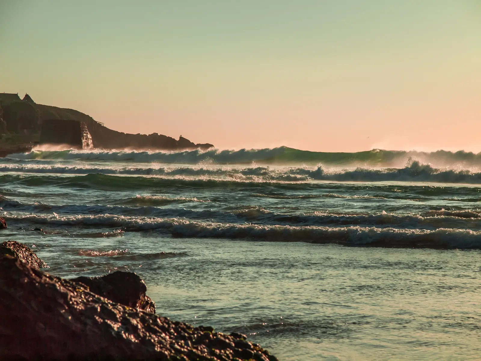 Pacific waves catching the last warm light of sunset
