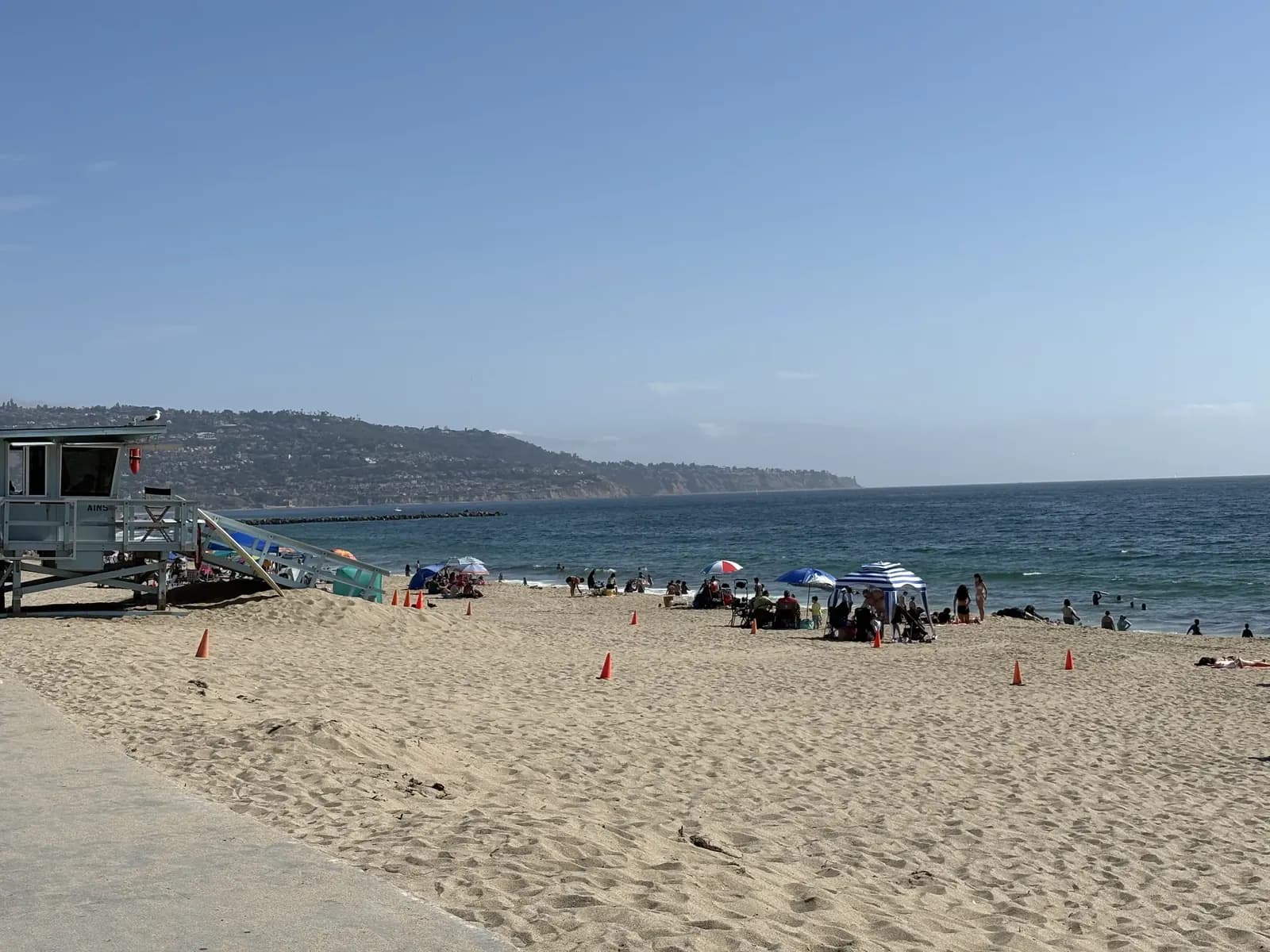 Beachgoers enjoying the sand and water along South Redondo Beach