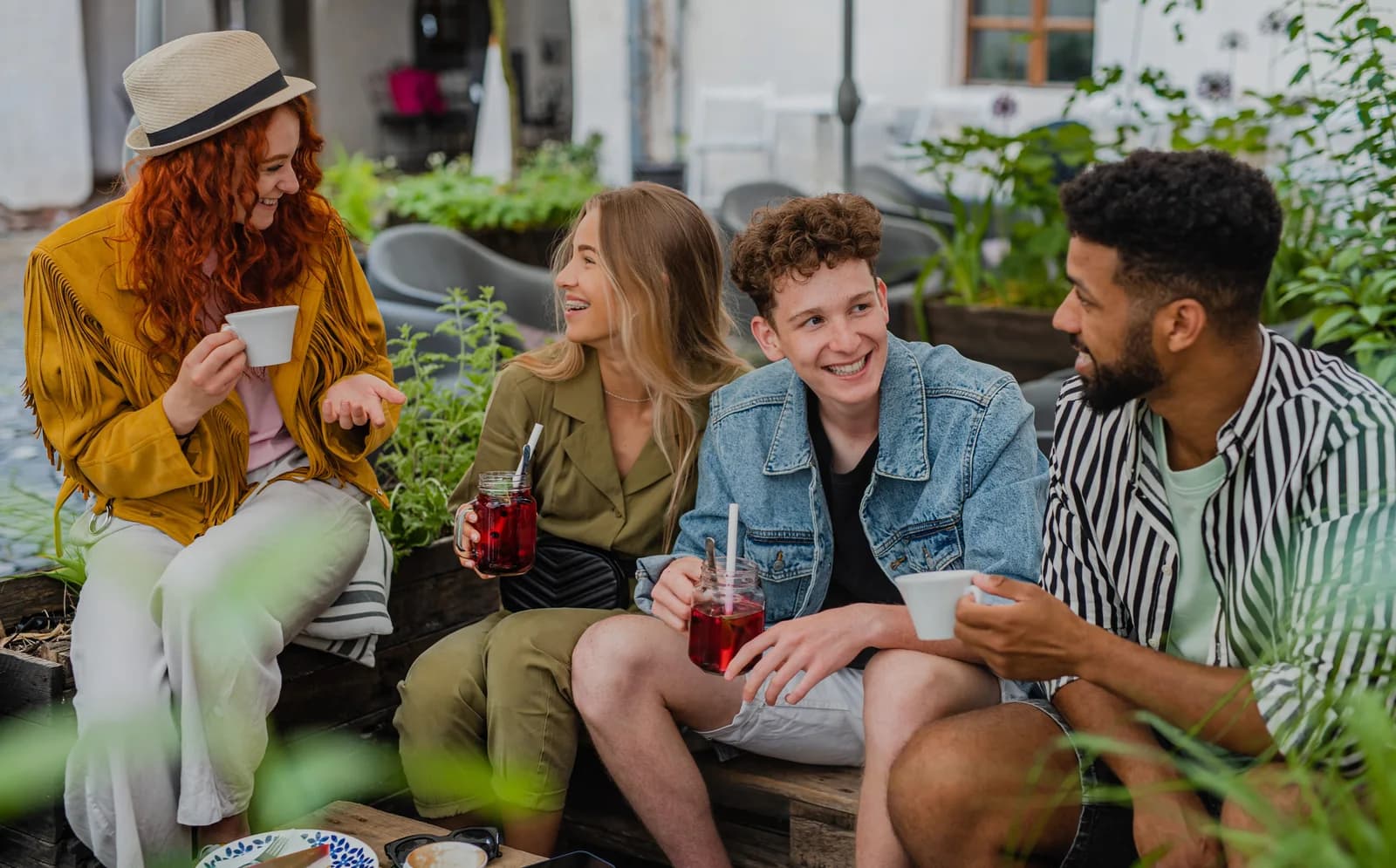 Friends catching up together at an outdoor cafe