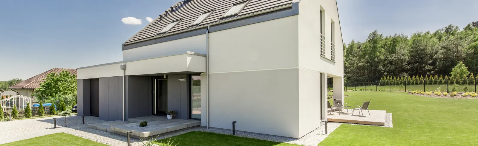 A bright modern home opening onto an established green yard