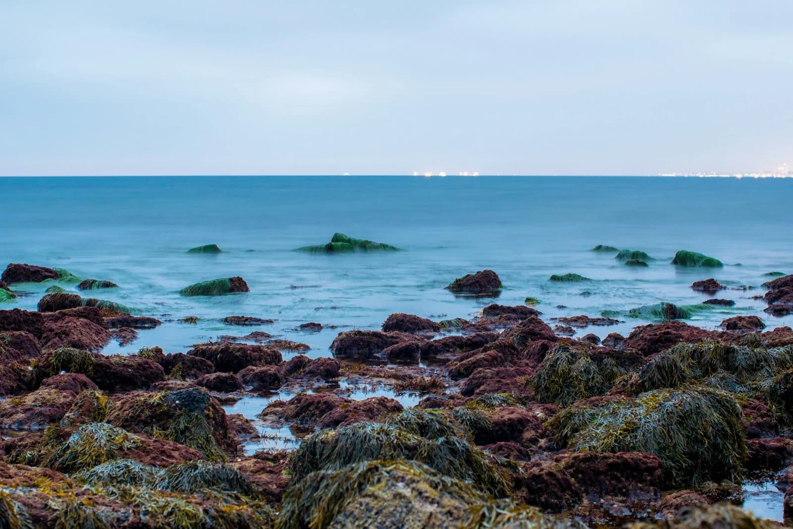 Rocky Palos Verdes tide pools meeting calm blue water