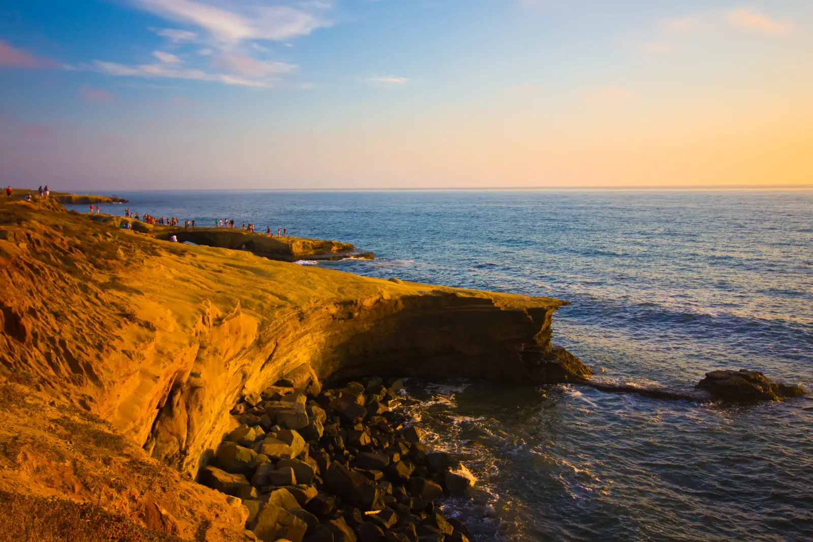 Warm Southern California cliffs meeting the Pacific at sunset