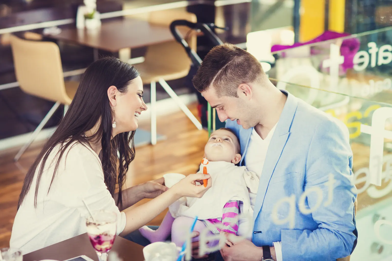 A family spending time together at a neighborhood cafe