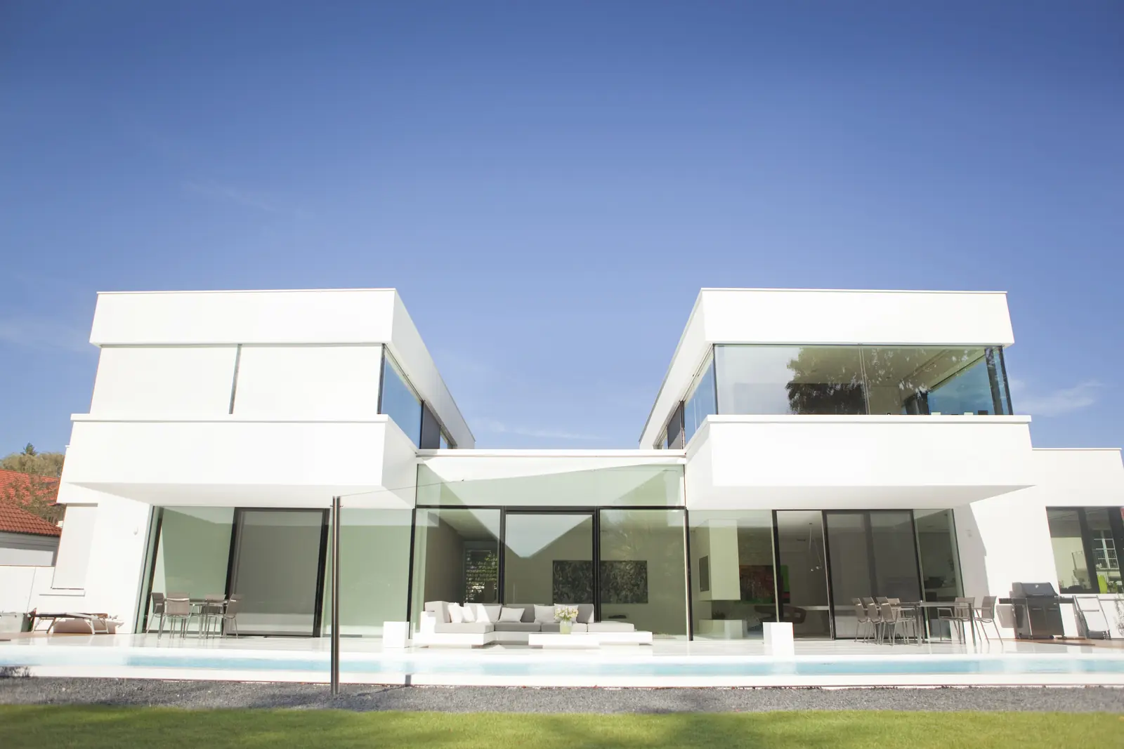 A clean-lined modern white home in a sunny coastal setting