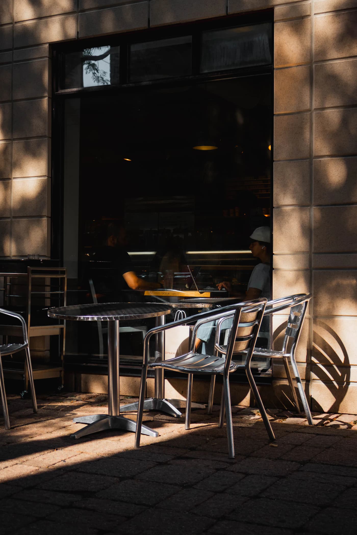 A welcoming sidewalk café with shaded tables