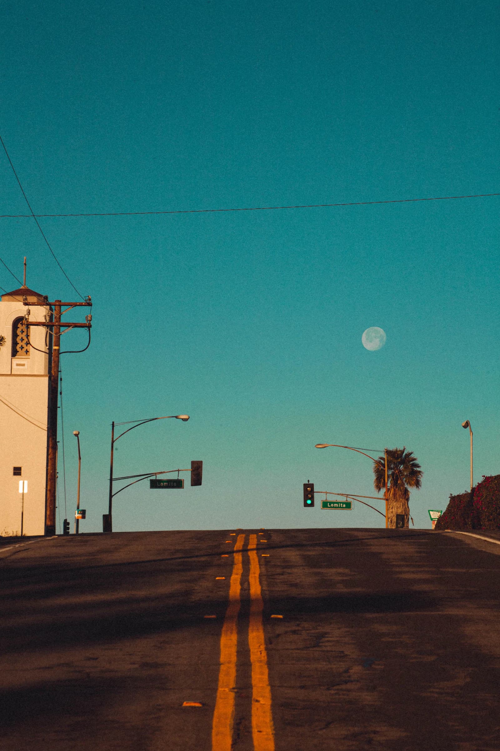A quiet Southern California neighborhood street at dawn