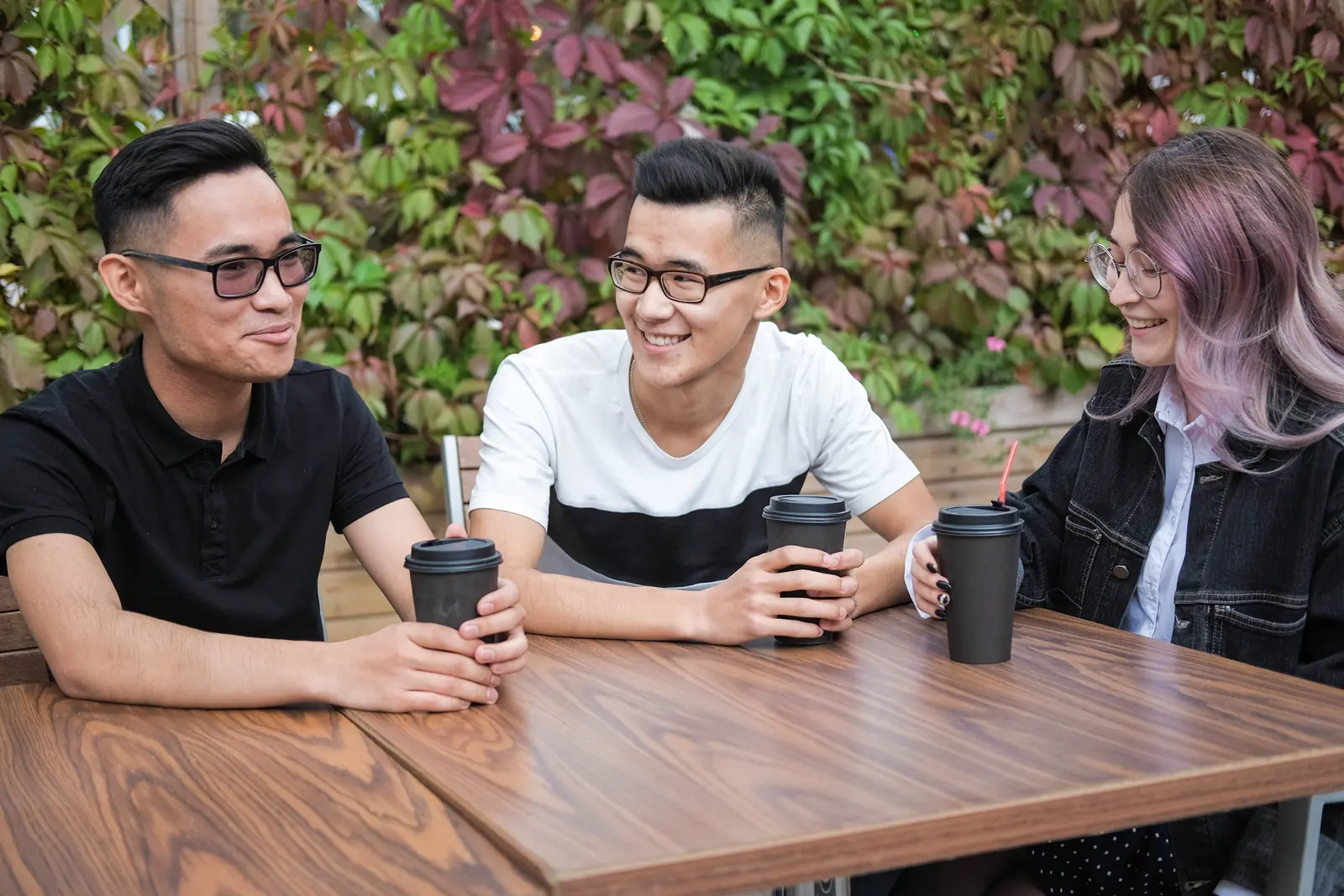 Friends gathering around a table at a neighborhood cafe