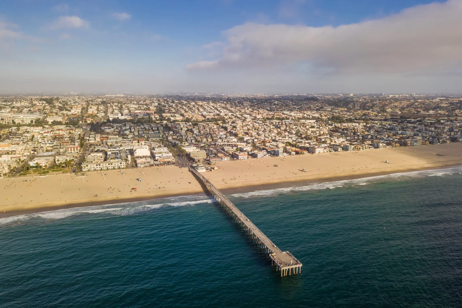 Hermosa Beach Pier and the surrounding coastal homes from above