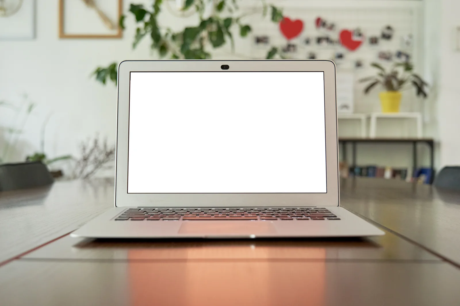 A laptop and design moodboard for planning market preparation