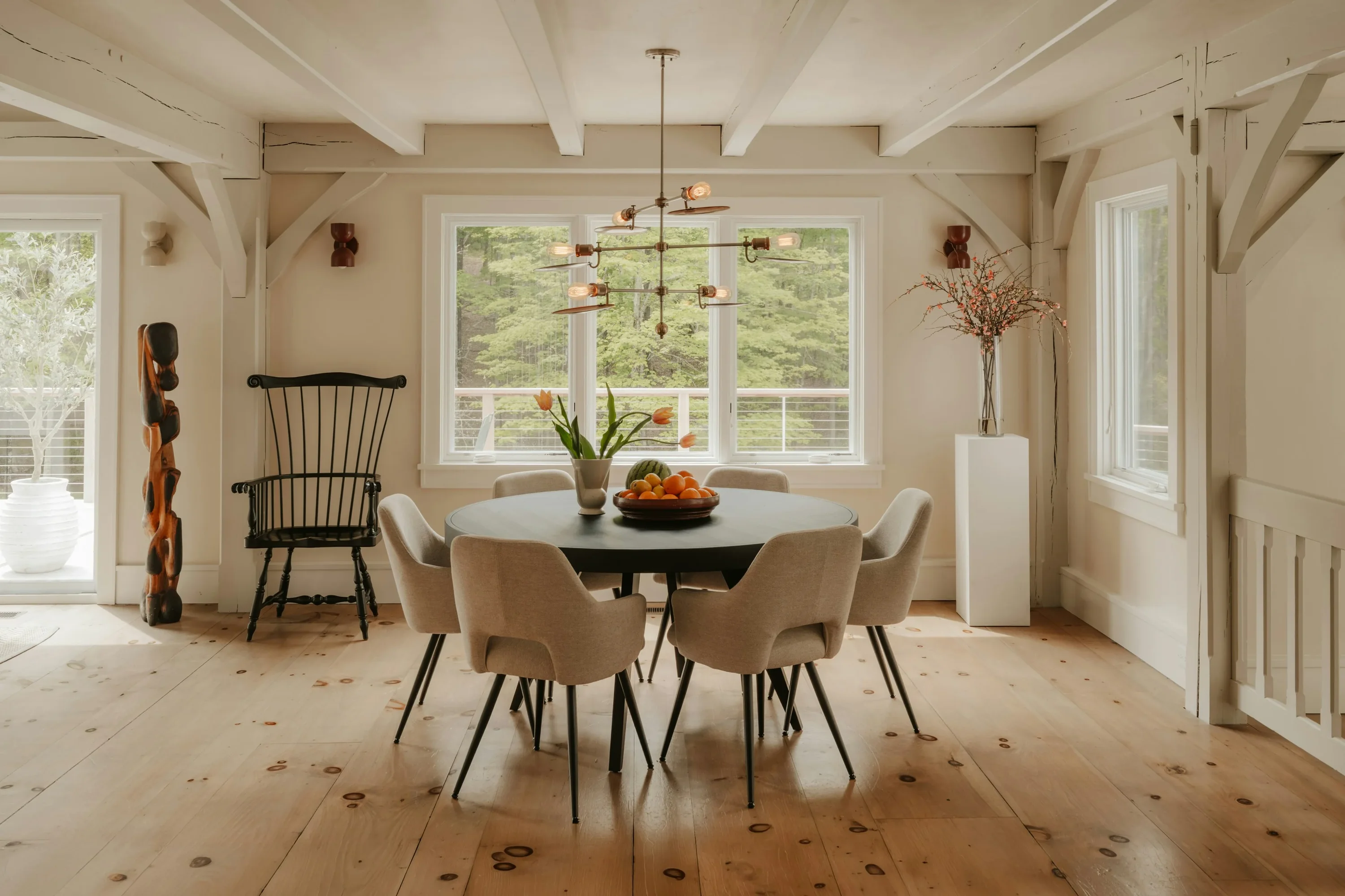 A carefully styled dining room filled with natural light