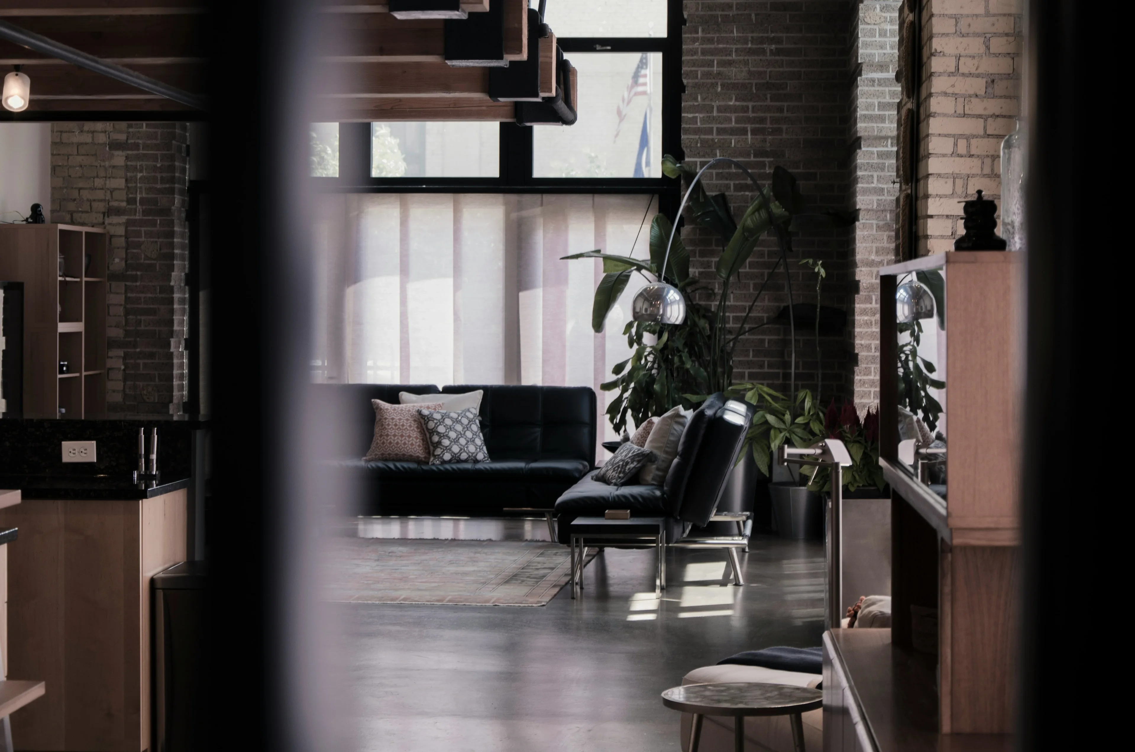 A private contemporary residence with dark brick and leather seating