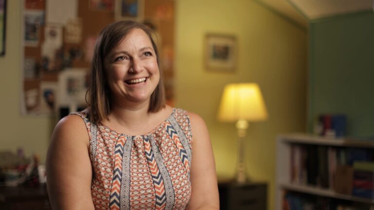 A woman smiling during an interview